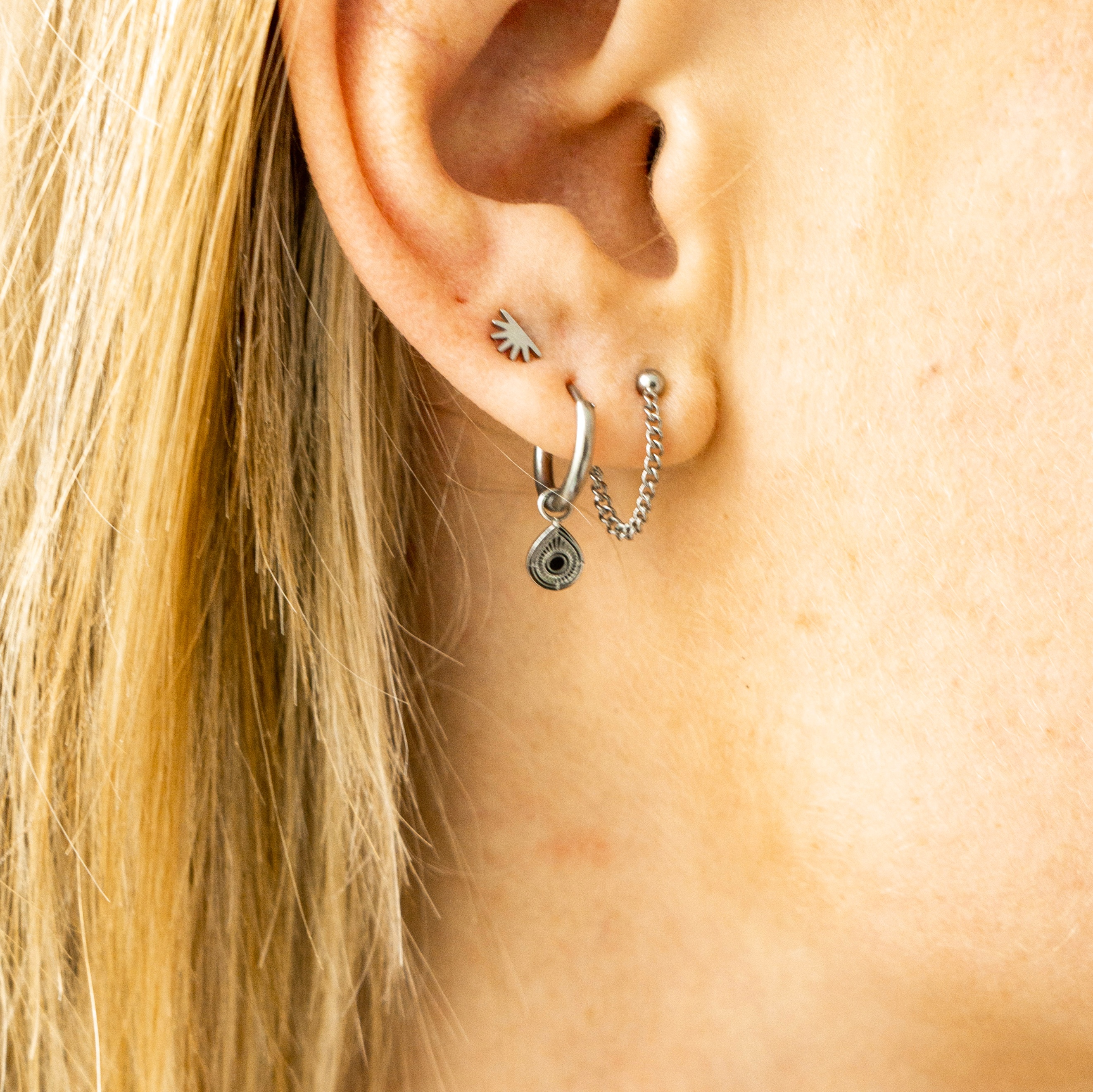 Stud earrings with chain dot