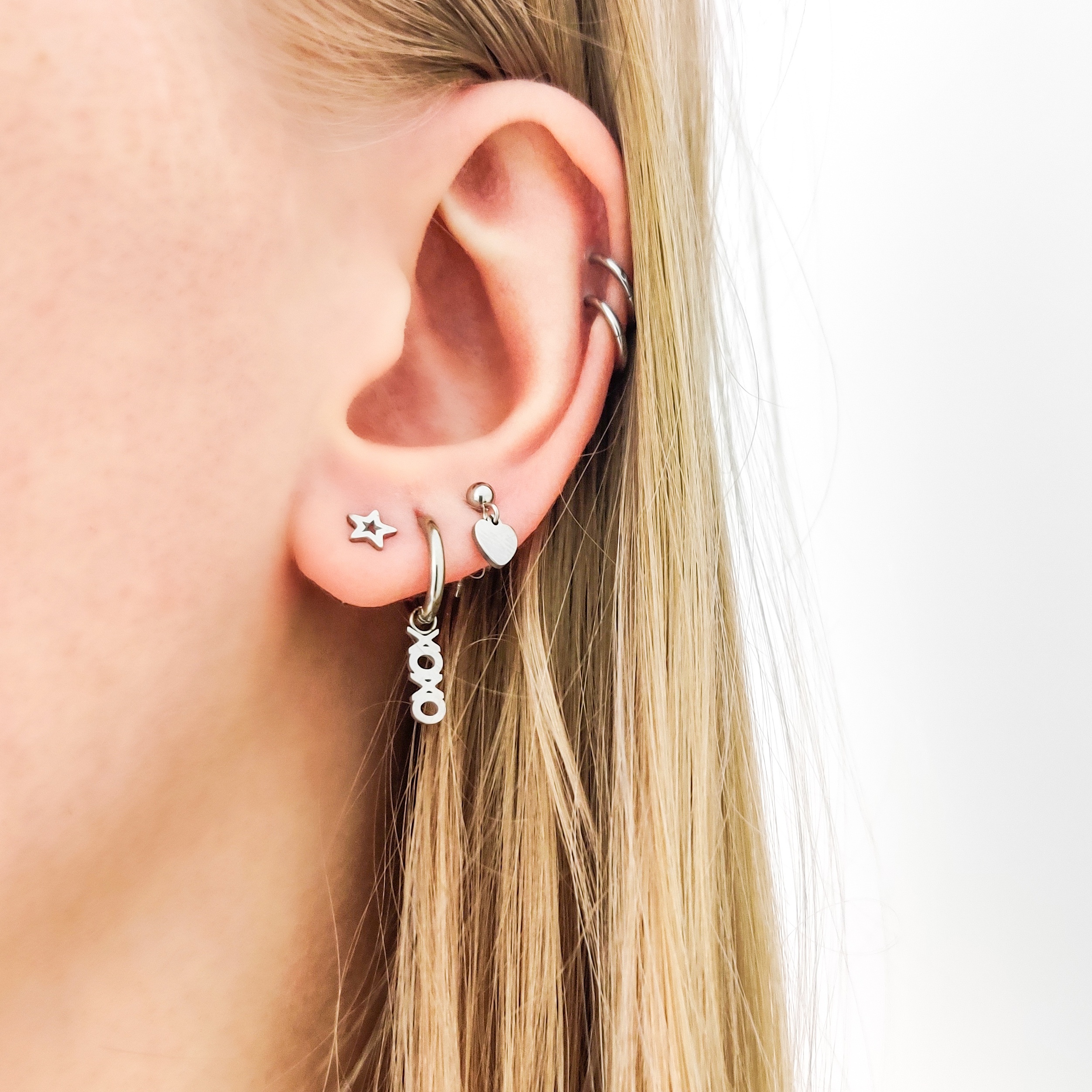 Stud earrings with charm heart