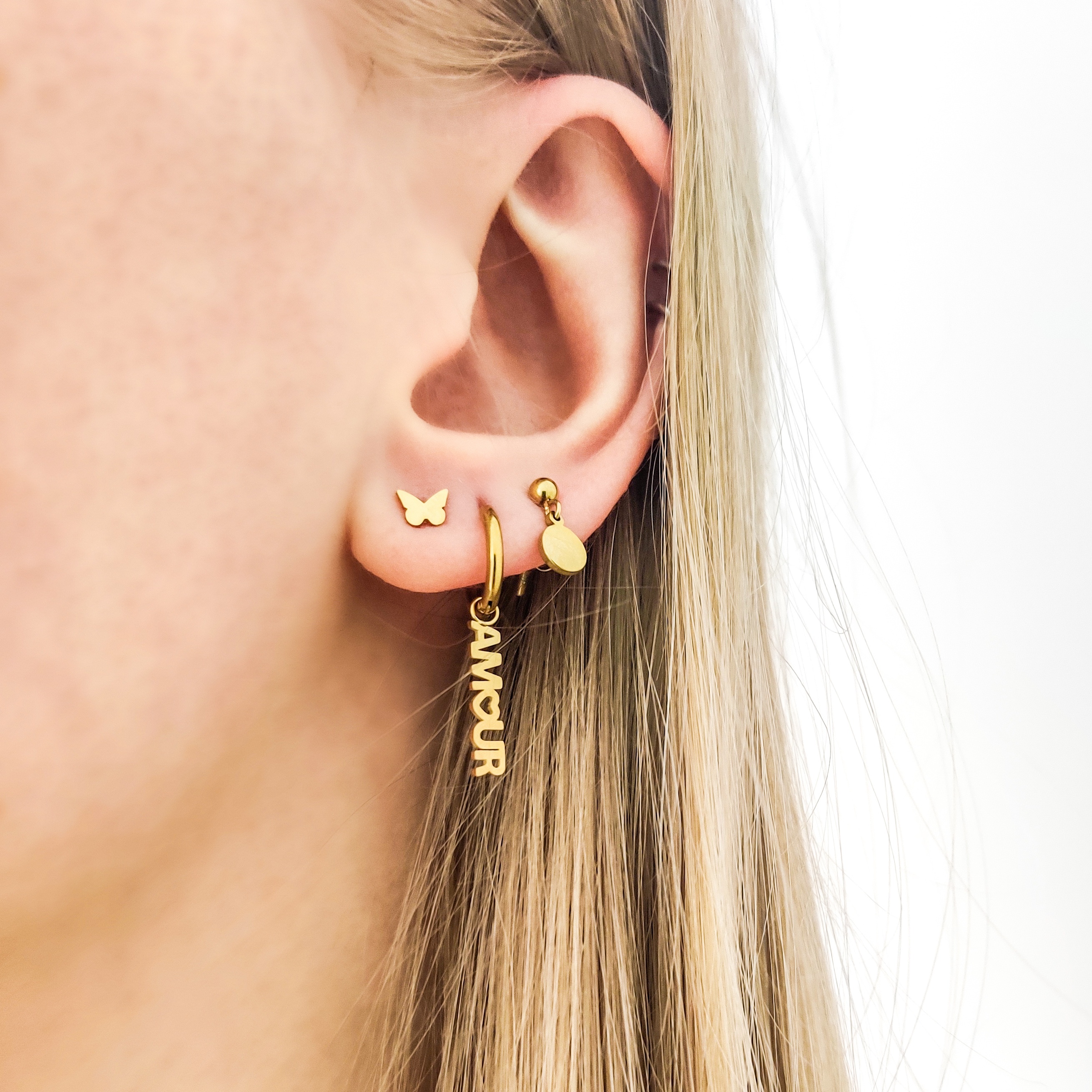 Stud earrings with charm coin